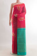 Pure Silk Brick Orange Kanjivaram Saree with Zari Butta on the body and Without Border.  displayed on a mannequin