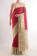 Pure Silk Red Kanjivaram Saree with Zari Butta on the body and Zari Border.  displayed on a mannequin