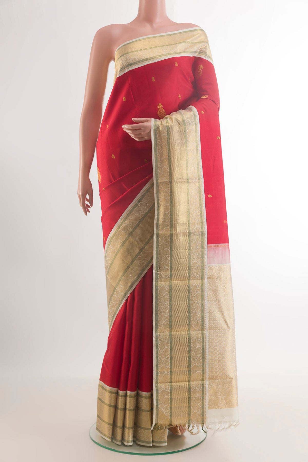 Pure Silk Red Kanjivaram Saree with Zari Butta on the body and Zari Border.  displayed on a mannequin