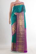 Pure Silk Sea Green Kanjivaram Saree with Checked design on the body and Zari Border.  displayed on a mannequin