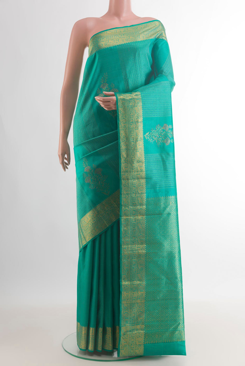 Pure Silk Sea Green Kanjivaram Saree with Zari Butta on the body and Zari Border.  displayed on a mannequin