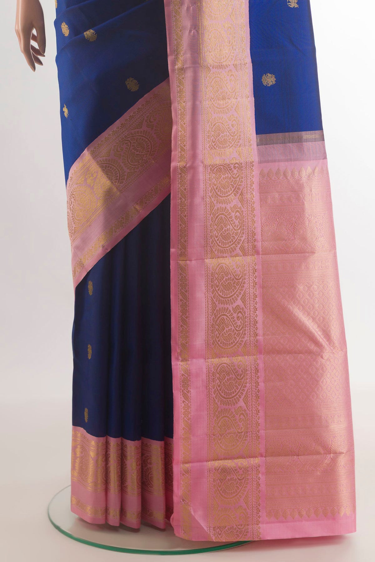 Pleats and pallu of Pure Silk Blue Kanchipuram Saree with Zari Butta on the body and Zari Border. 