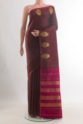 Pure Silk Brown Kanchipuram Saree with Plain Body and Zari Border.  displayed on a mannequin