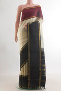 Pure Silk Cream Kanjivaram Saree with Plain Body and Ganga Jamuna Border.  displayed on a mannequin