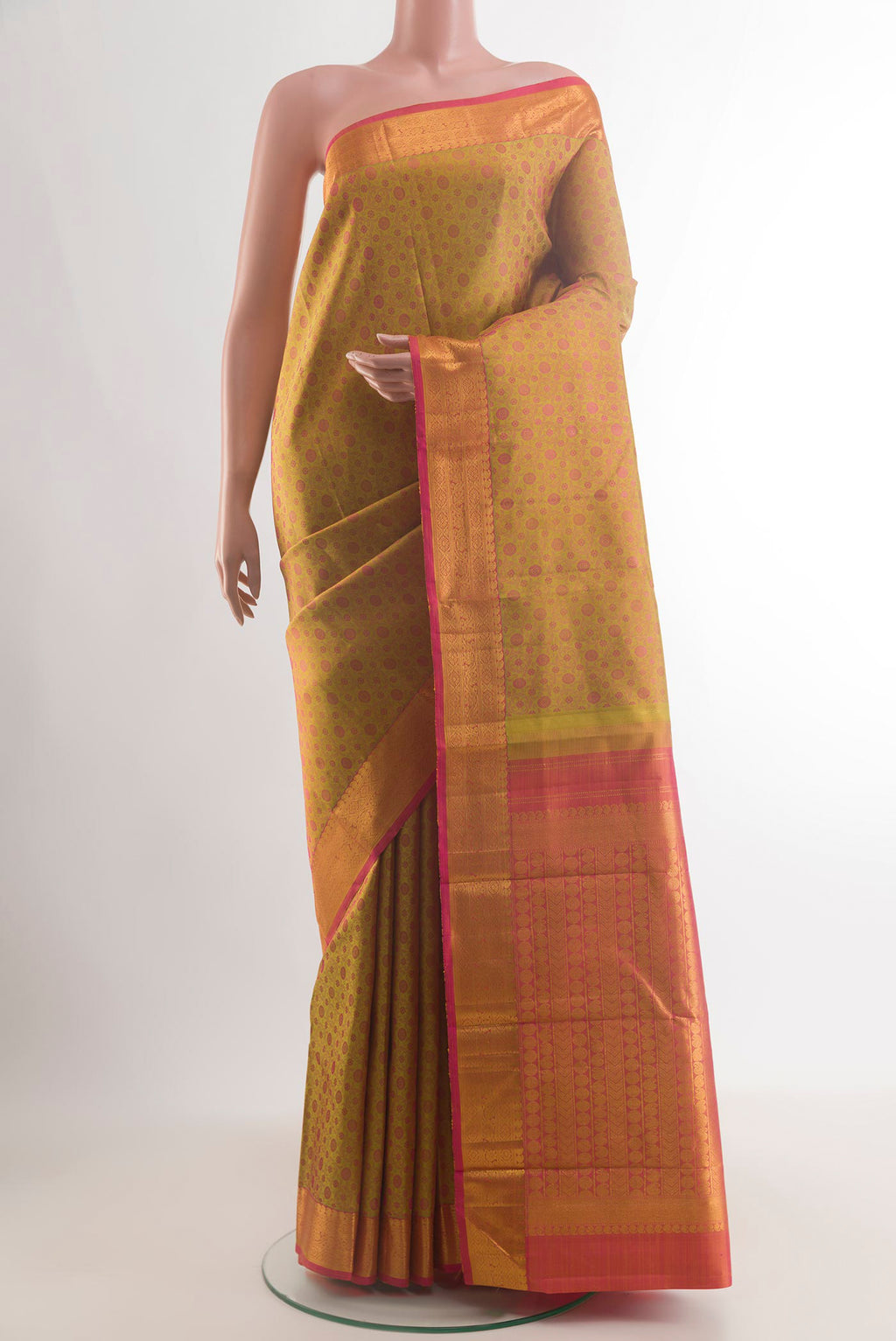 Pure Silk Mustard Kanjivaram Saree with Jacquard design on the body and Zari Border.  displayed on a mannequin