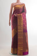 Pure Silk Purple Kanjivaram Saree with Jacquard With Zari Butta on the body and Zari Border.  displayed on a mannequin