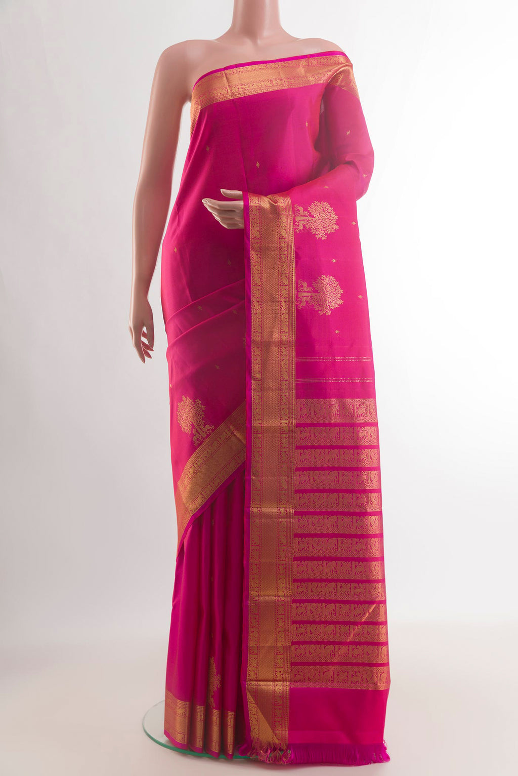 Pure Silk Pink Kanjivaram Saree with Zari Butta on the body and Zari Border.  displayed on a mannequin