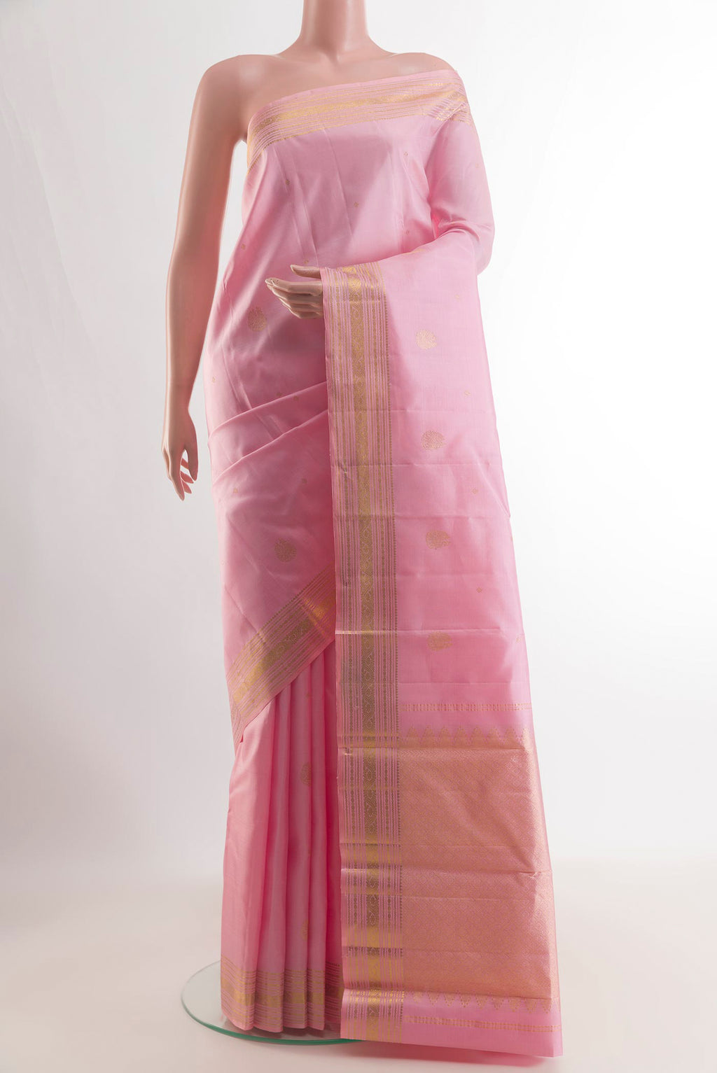Pure Silk Rose pink Kanchipuram Saree with Zari Butta on the body and Zari Border.  displayed on a mannequin