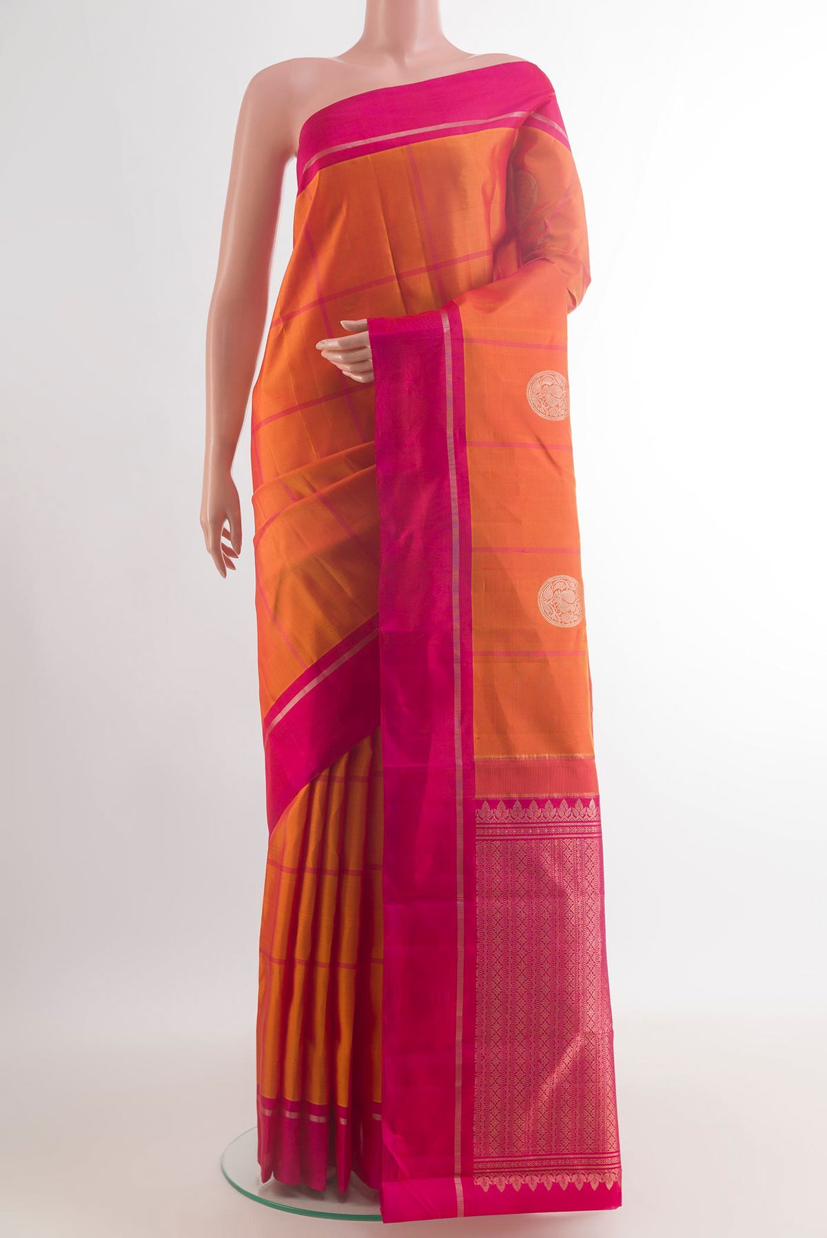 Pure Silk Orange Kanchipuram Saree with Checked design on the body and Zari Border.  displayed on a mannequin