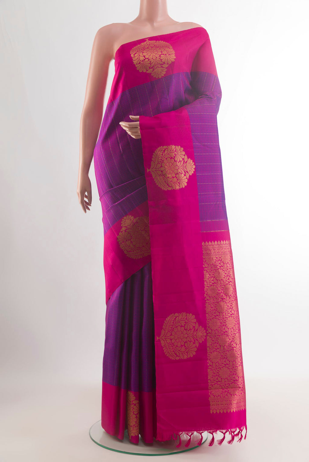 Pure Silk Purple Kanchipuram Saree with Checked design on the body and Zari Border.  displayed on a mannequin