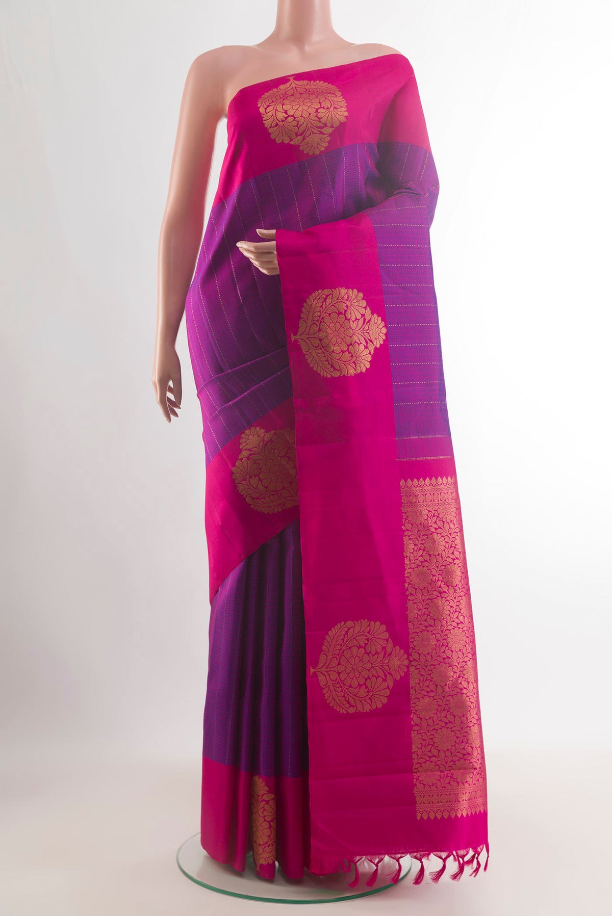 Pure Silk Purple Kanchipuram Saree with Checked design on the body and Zari Border.  displayed on a mannequin