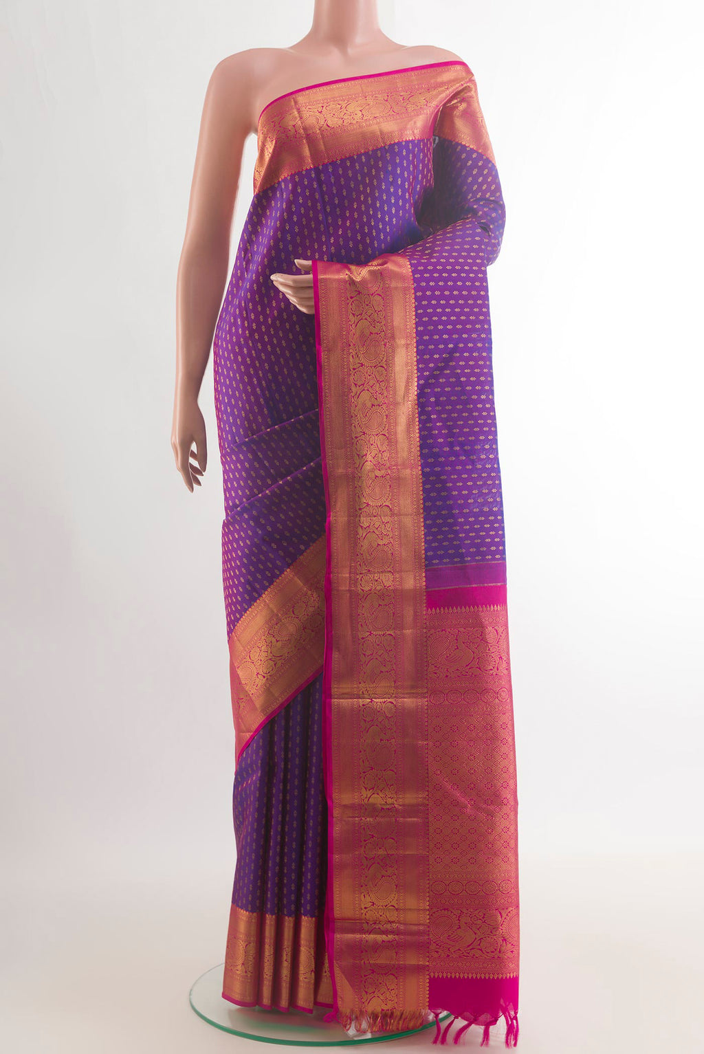 Pure Silk Purple Kanjivaram Saree with Zari Butta on the body and Zari Border.  displayed on a mannequin