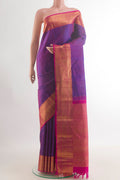 Pure Silk Purple Kanjivaram Saree with Zari Butta on the body and Zari Border.  displayed on a mannequin