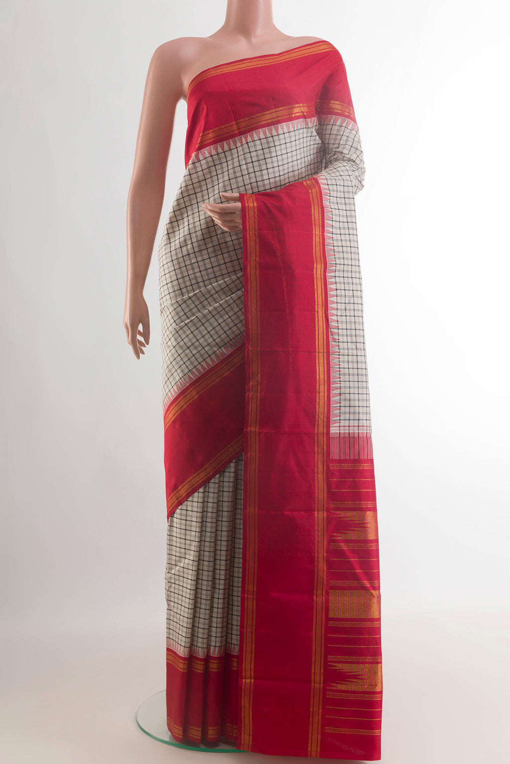 Pure Silk Off White Kanjivaram Saree with Checked design on the body and Zari Border.  displayed on a mannequin