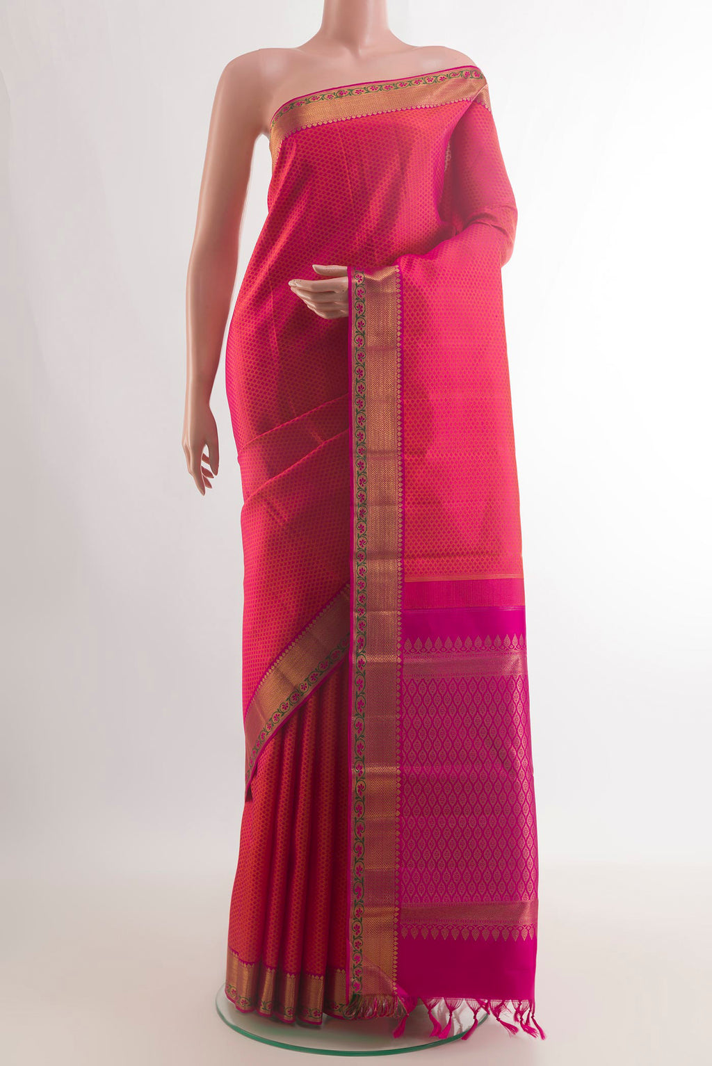 Pure Silk Orange with Pink Color Kanchipuram Saree with Jacquard design on the body and Zari Border.  displayed on a mannequin