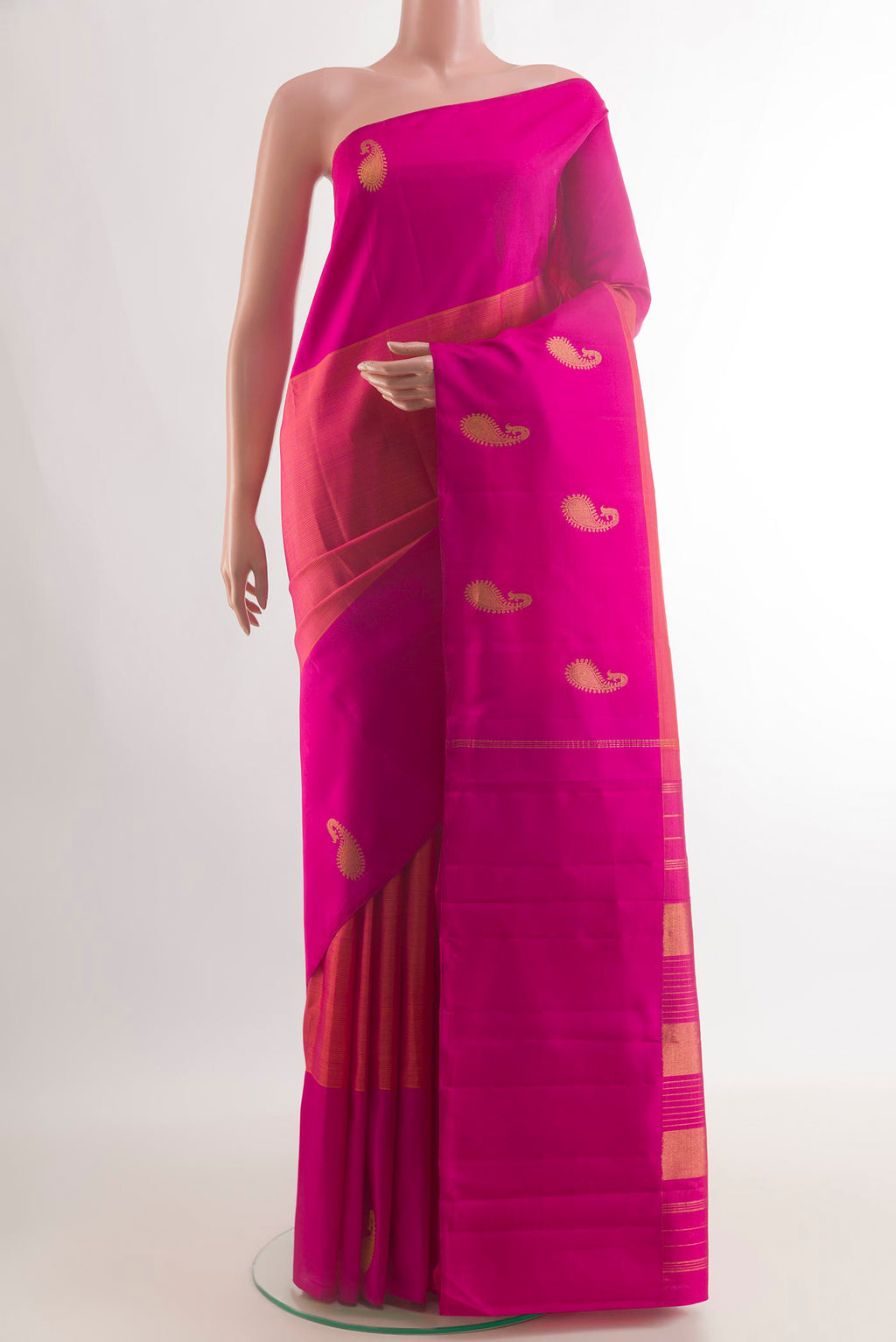 Pure Silk Brick Orange Kanjivaram Saree with Stripes on the body and Plain Border.  displayed on a mannequin