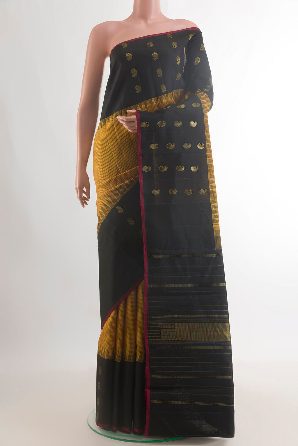 Pure Silk Yellow Kanjivaram Saree with Checked design on the body and Fancy Border.  displayed on a mannequin