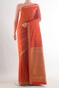 Pure Silk Orange Kanjivaram Saree with Thread Butta on the body and Thread Border.  displayed on a mannequin