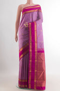 Pure Silk Lavender Kanjivaram Saree with Zari Butta on the body and Zari Border.  displayed on a mannequin