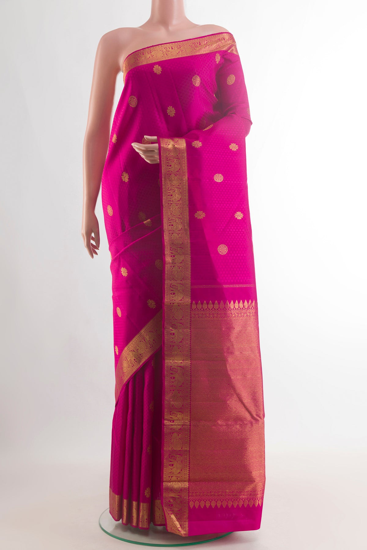 Pure Silk Pink Kanjivaram Saree with Jacquard With Zari Butta on the body and Zari Border.  displayed on a mannequin