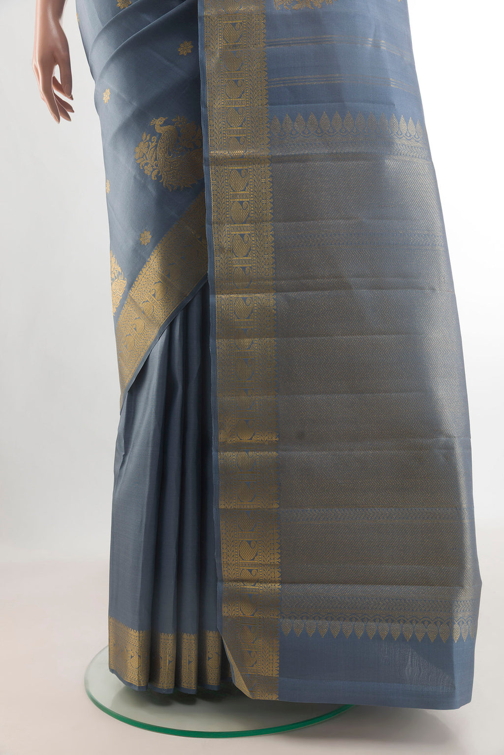 Pleats and pallu of Pure Silk Blue Grey Kanchipuram Saree with Zari Butta on the body and Zari Border. 