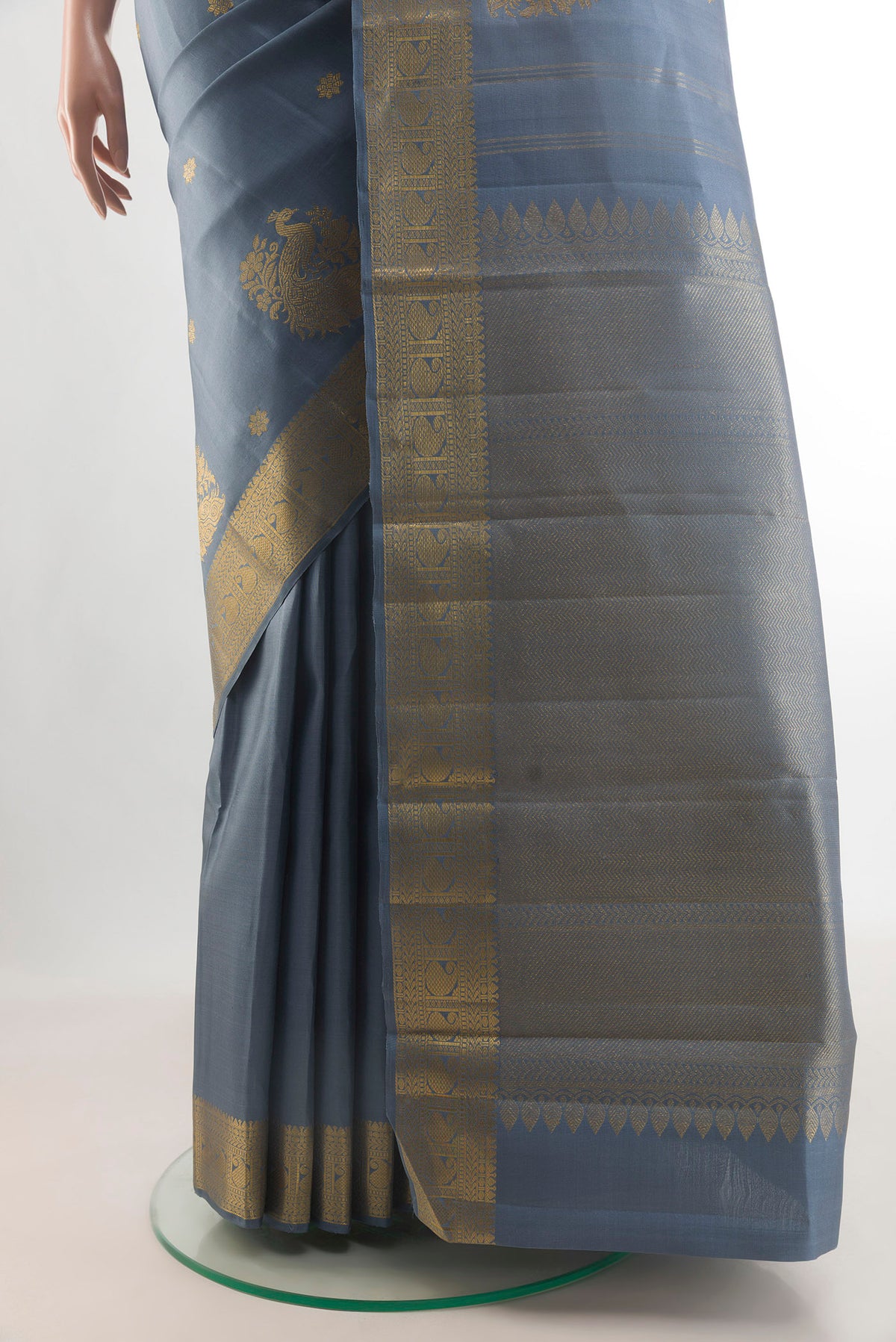 Pleats and pallu of Pure Silk Blue Grey Kanchipuram Saree with Zari Butta on the body and Zari Border. 