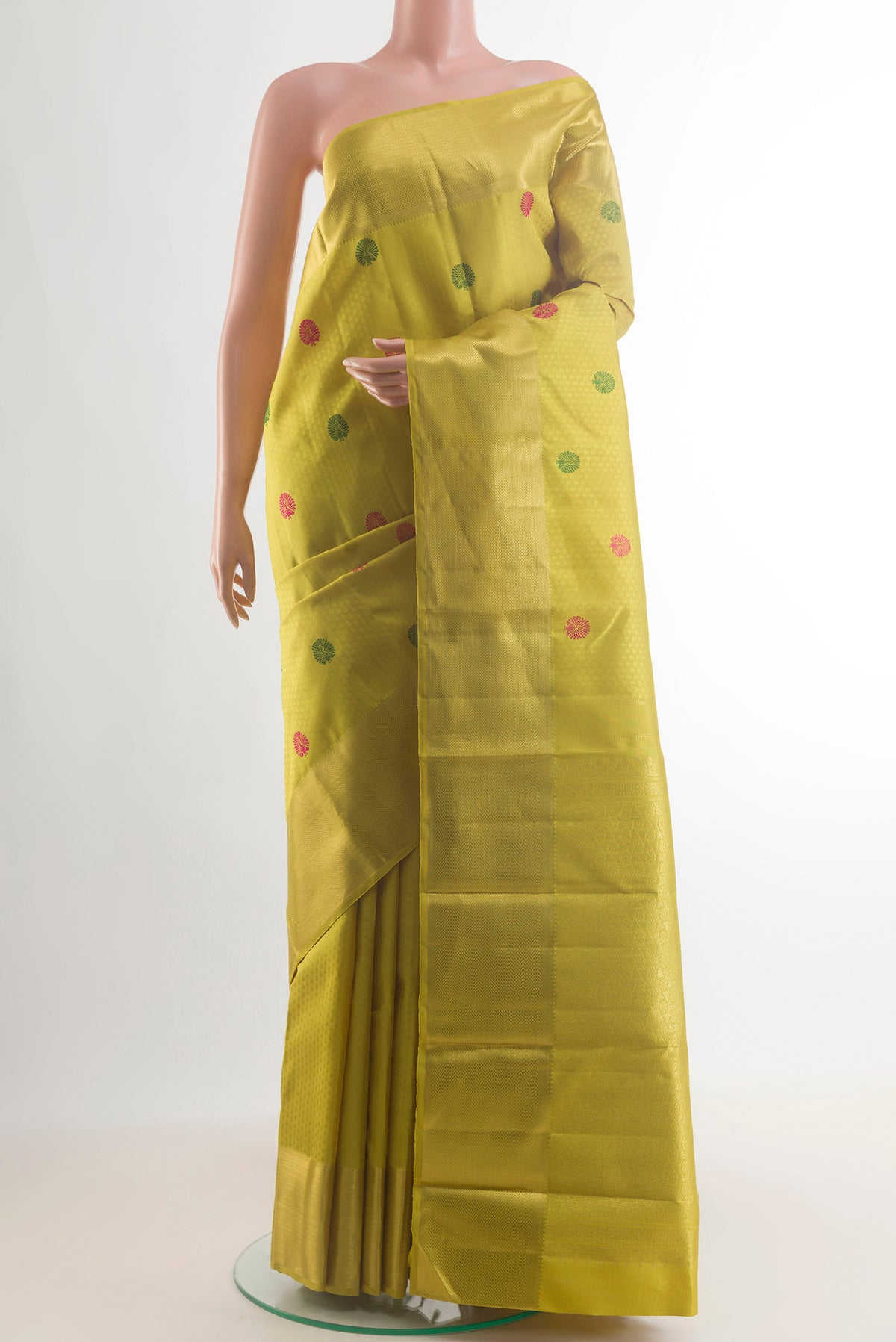 Pure Silk Yellow Kanjivaram Saree with Jacquard With Thread Butta on the body and Zari Border.  displayed on a mannequin