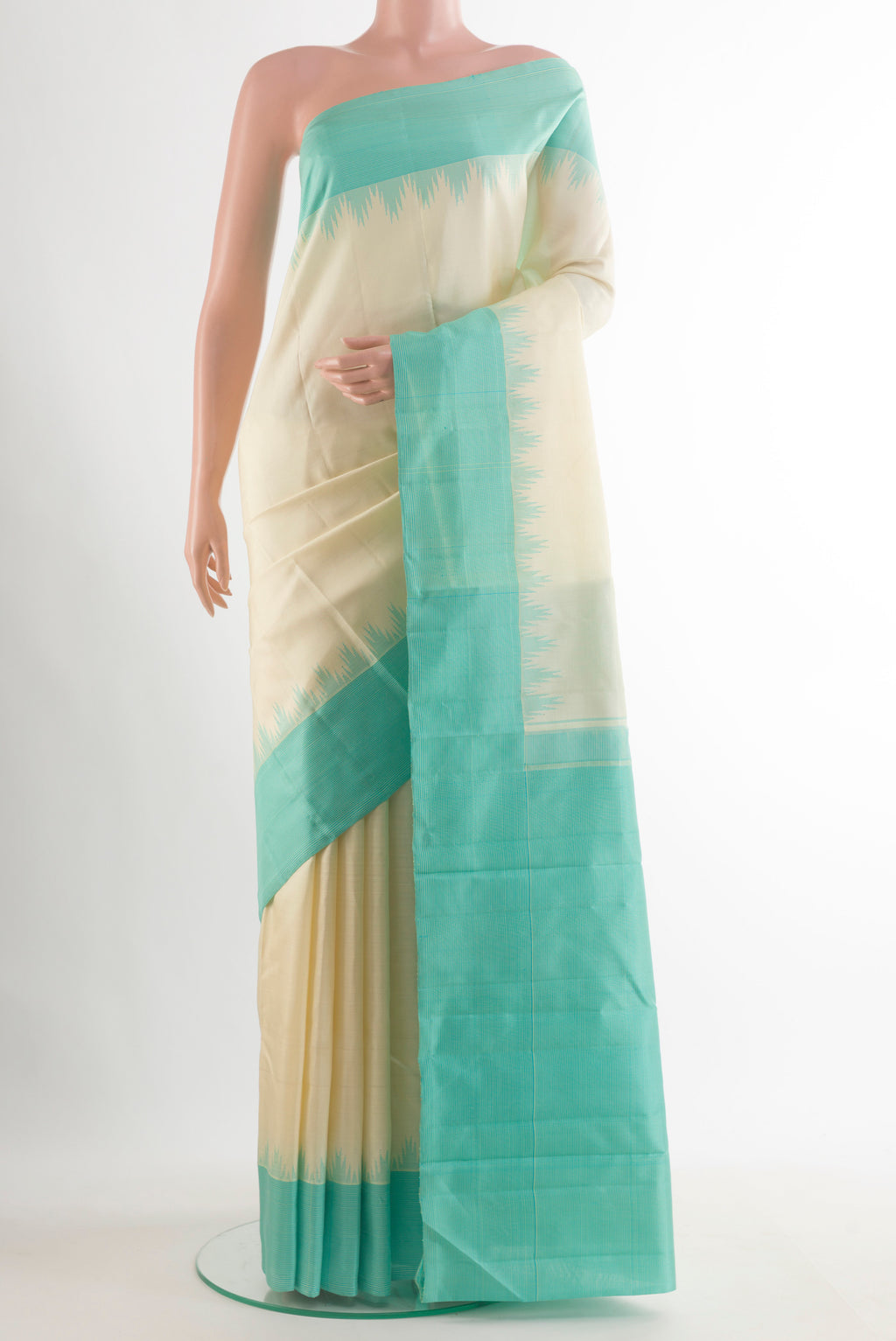 Pure Silk Cream Kanjivaram Saree with Plain Body and Temple Border.  displayed on a mannequin