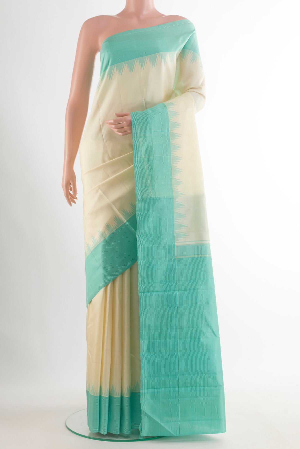 Pure Silk Cream Kanjivaram Saree with Plain Body and Temple Border.  displayed on a mannequin