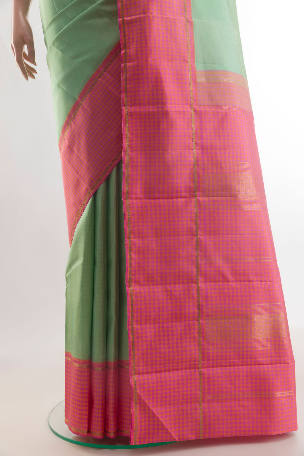Pleats and pallu of Pure Silk Pista Green Kanjivaram Saree with Plain Body and Zari Border. 
