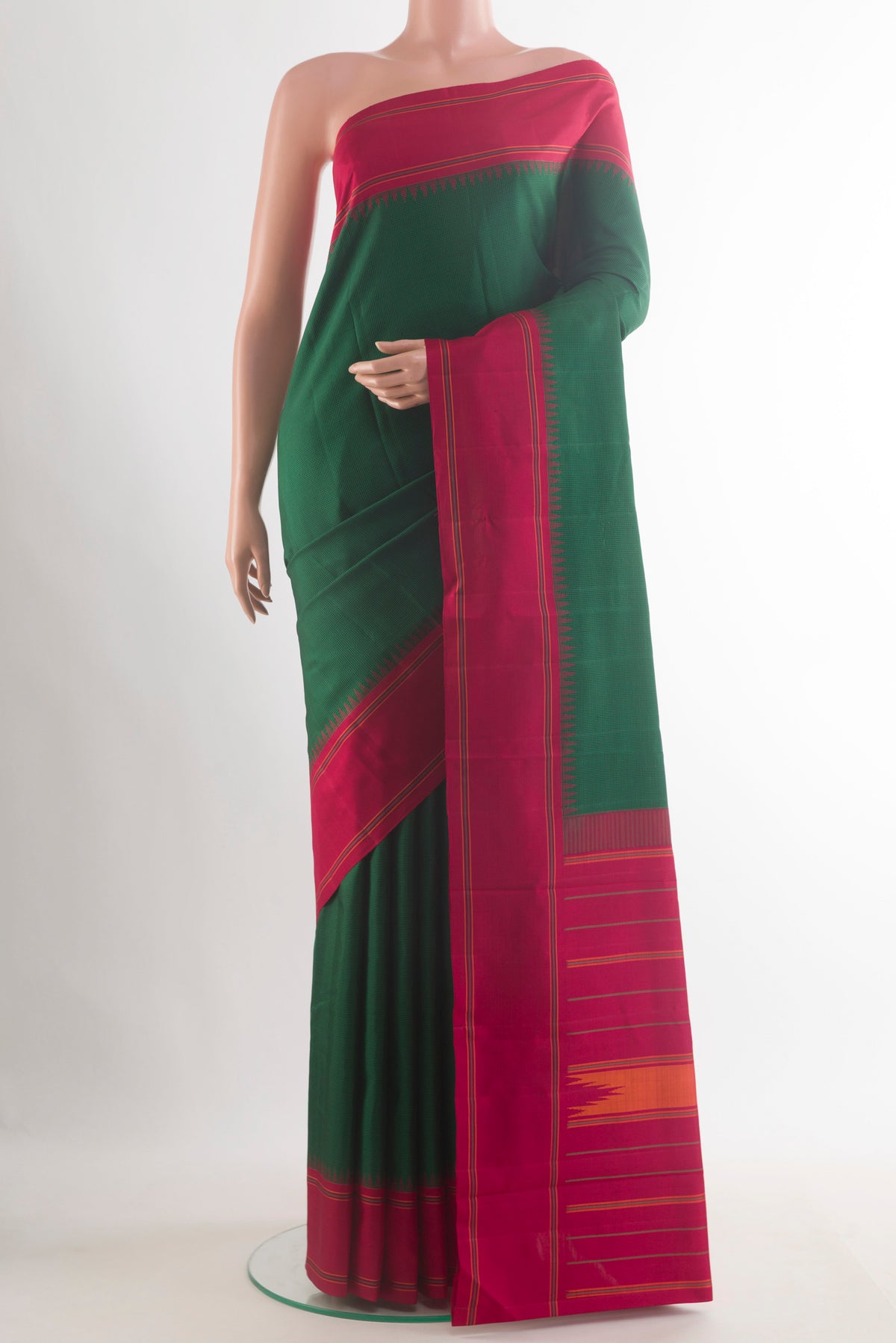Pure Silk Green Kanjivaram Saree with Checked design on the body and Plain Border.  displayed on a mannequin