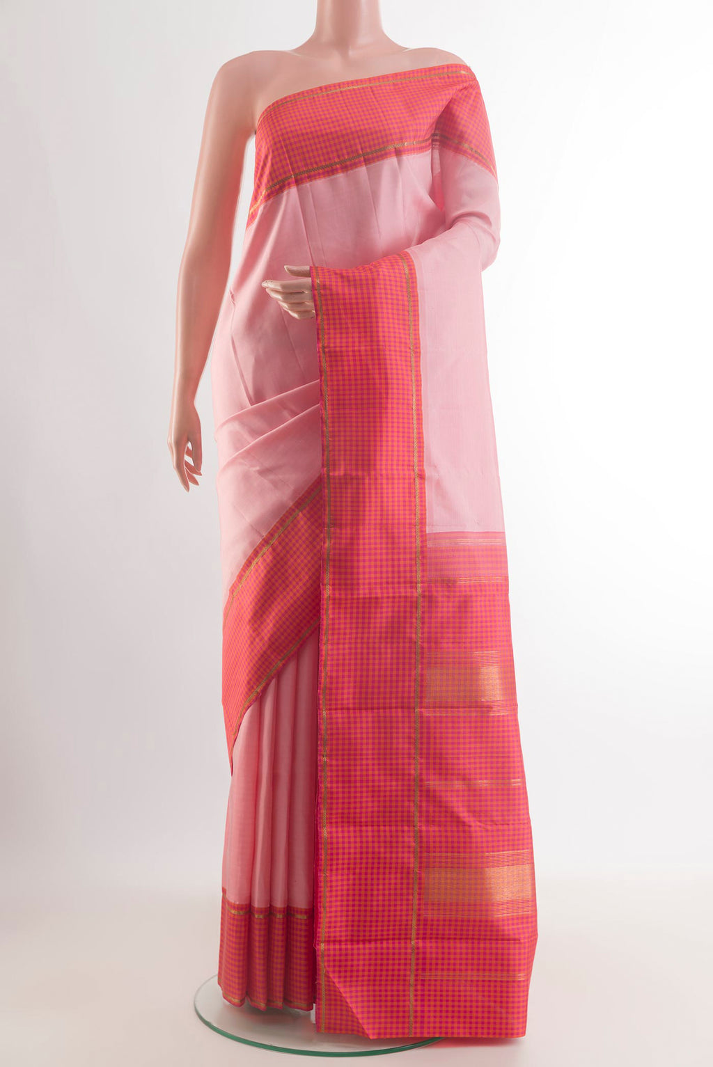Pure Silk Peach Kanjivaram Saree with Plain Body and Checks Border.  displayed on a mannequin