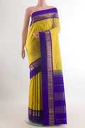 Pure Silk Yellow Kanjivaram Saree with Plain Body and Zari Border.  displayed on a mannequin