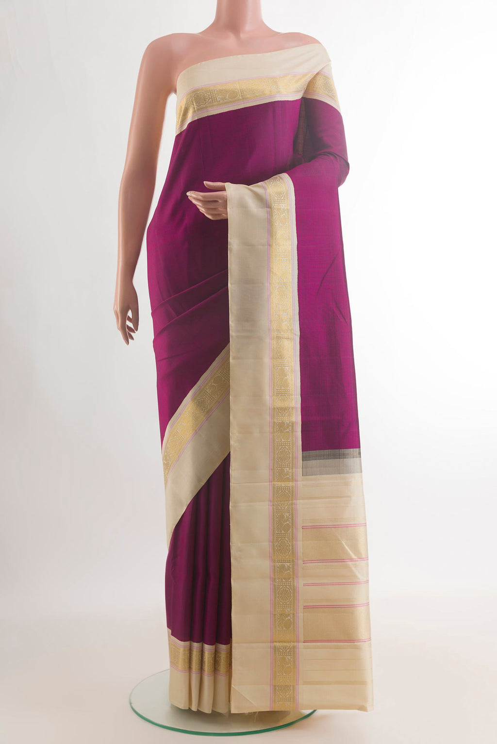 Pure Silk Magenta Kanjivaram Saree with Plain Body and Plain Border.  displayed on a mannequin