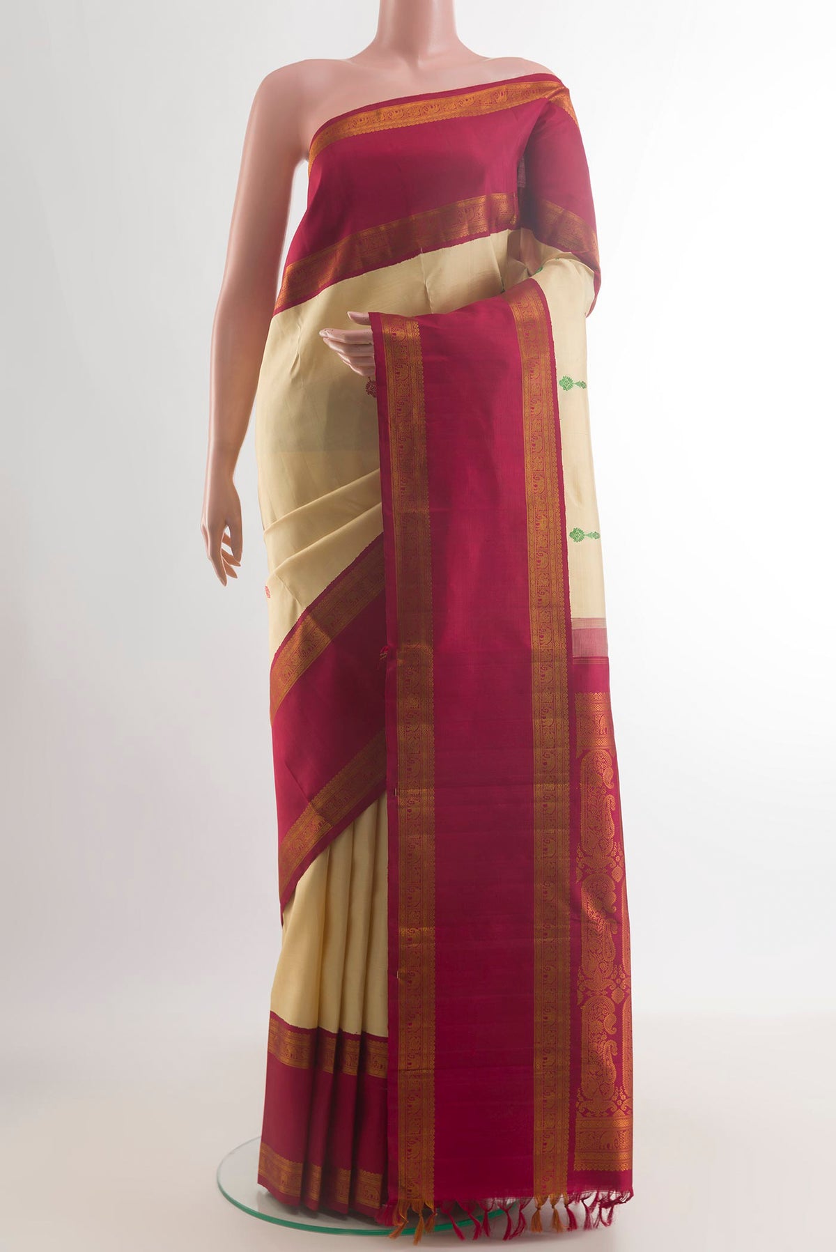 Pure Silk Sandal Kanjivaram Saree with Thread Butta on the body and Zari Border.  displayed on a mannequin