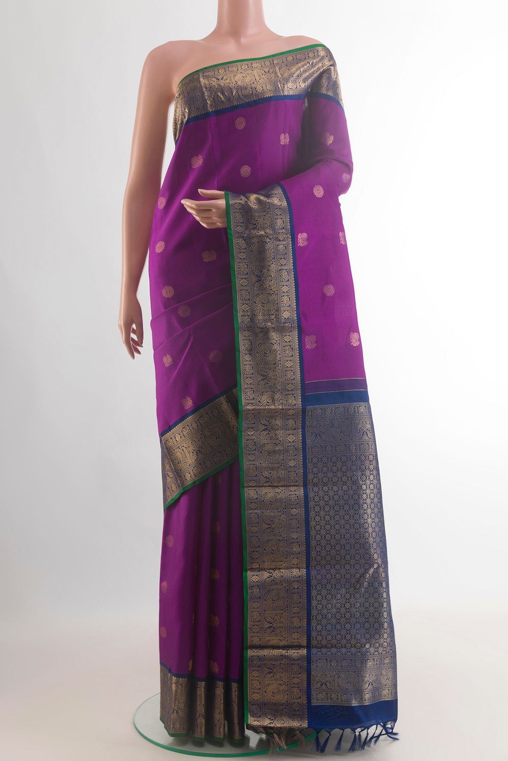 Pure Silk Purple Kanjivaram Saree with Zari Butta on the body and Zari Border.  displayed on a mannequin