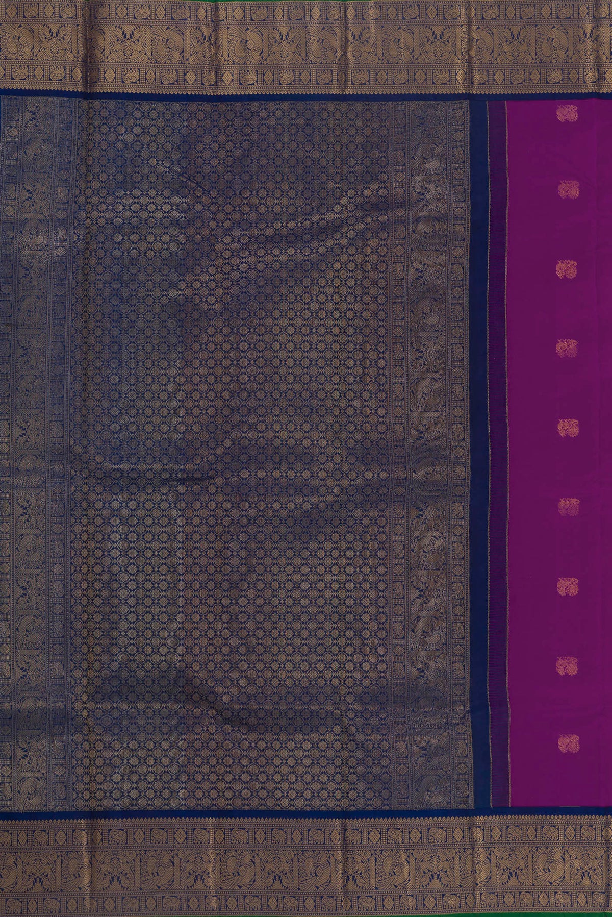 Close up image of the pallu of Pure Silk Purple Kanjivaram Saree with Zari Butta on the body and Zari Border. 