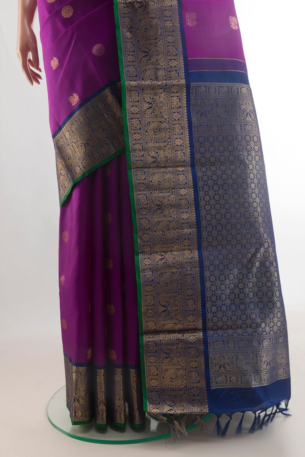 Pleats and pallu of Pure Silk Purple Kanjivaram Saree with Zari Butta on the body and Zari Border. 