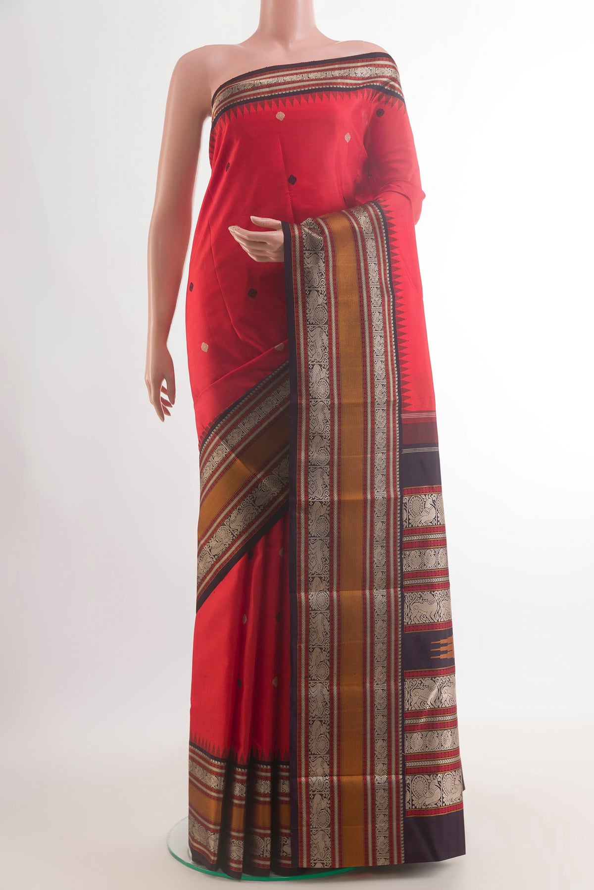 Pure Silk Red Kanjivaram Saree with Thread Butta on the body and Zari Border.  displayed on a mannequin