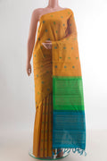 Pure Silk Mustard Kanchipuram Saree with Thread Butta on the body and Without Border.  displayed on a mannequin