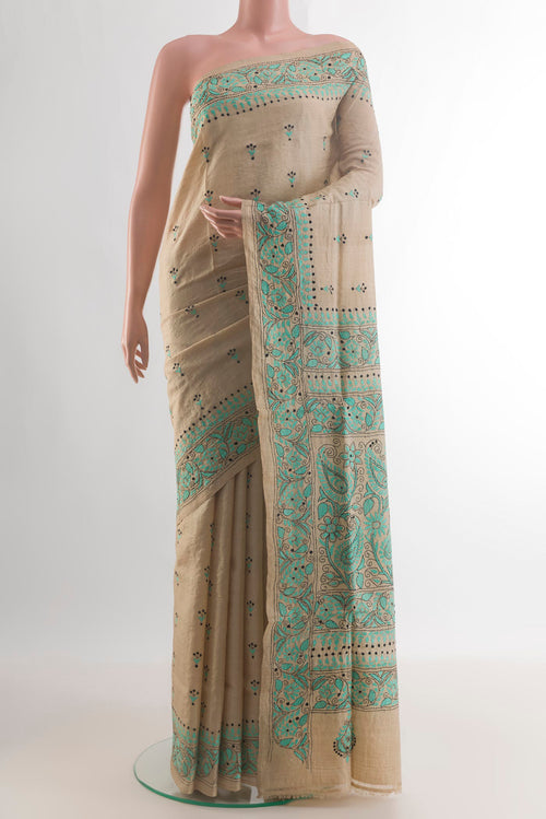 Beige Tussar Saree with Kantha Work on the body and Embroidery Border.  displayed on a mannequin