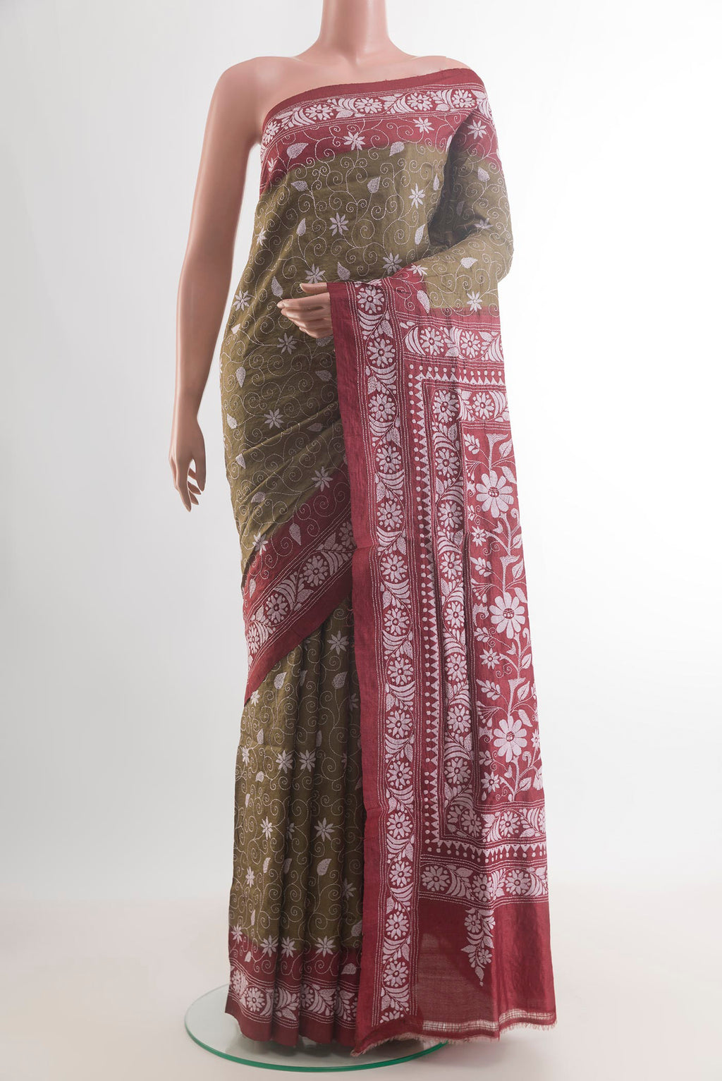 Green Tussar Saree with Kantha Work on the body and Embroidery Border.  displayed on a mannequin
