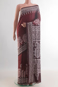 Maroon Tussar Saree with Kantha Work on the body and Embroidery Border.  displayed on a mannequin