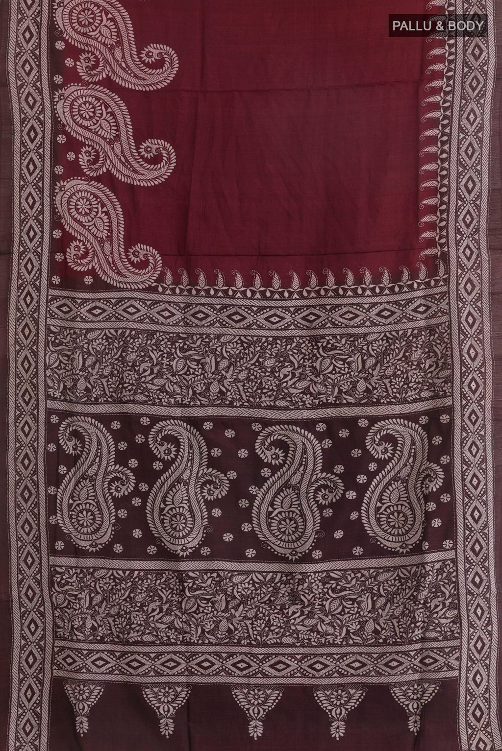 Flat view of Maroon Tussar Saree with Kantha Work on the body and Embroidery Border. 