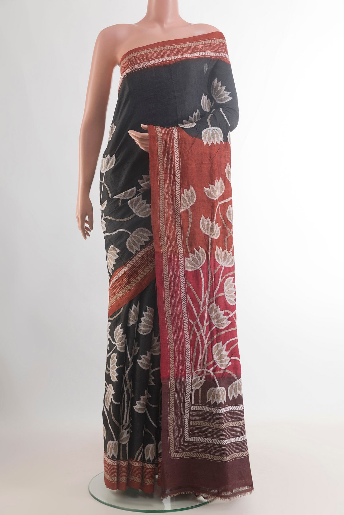 Black Tussar Saree with Kantha Work on the body and Embroidery Border.  displayed on a mannequin