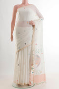 White Cotton Saree with Thread Butta on the body and Plain Border.  displayed on a mannequin
