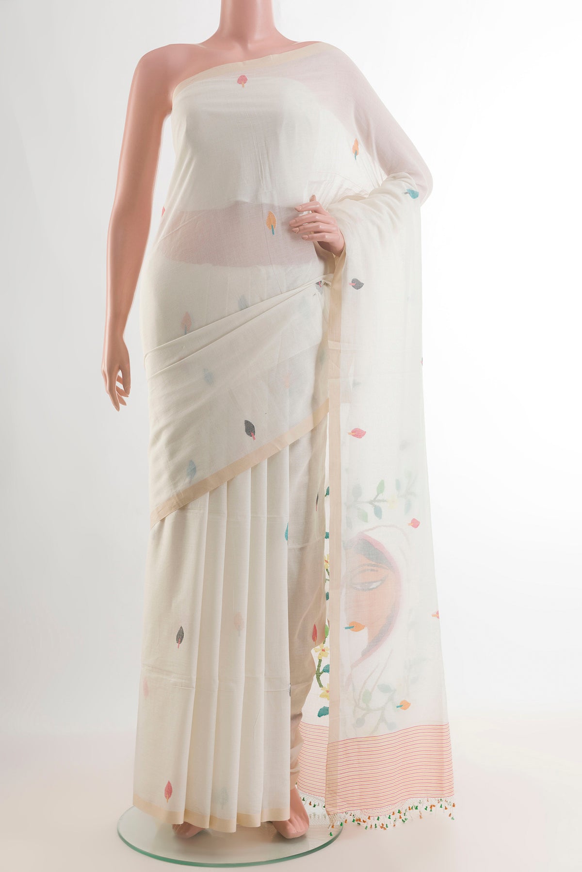 White Cotton Saree with Thread Butta on the body and Plain Border.  displayed on a mannequin