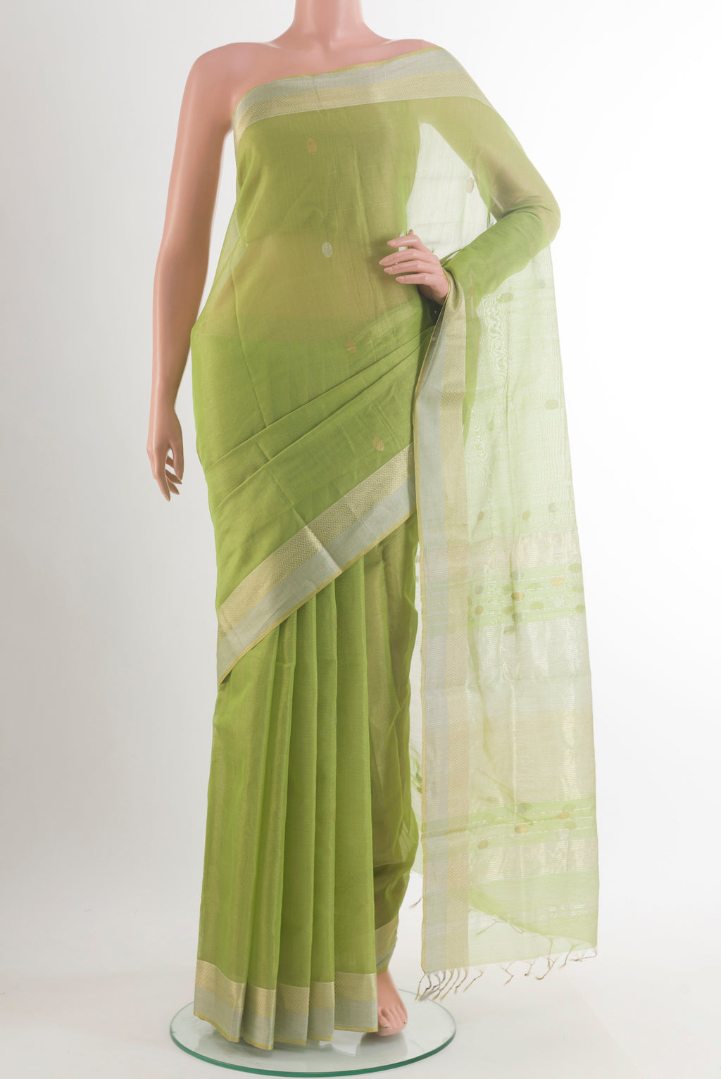 Light Green Maheshwari Cotton Saree with Zari Butta on the body and Zari Border.  displayed on a mannequin