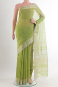 Light Green Maheshwari Cotton Saree with Zari Butta on the body and Zari Border.  displayed on a mannequin