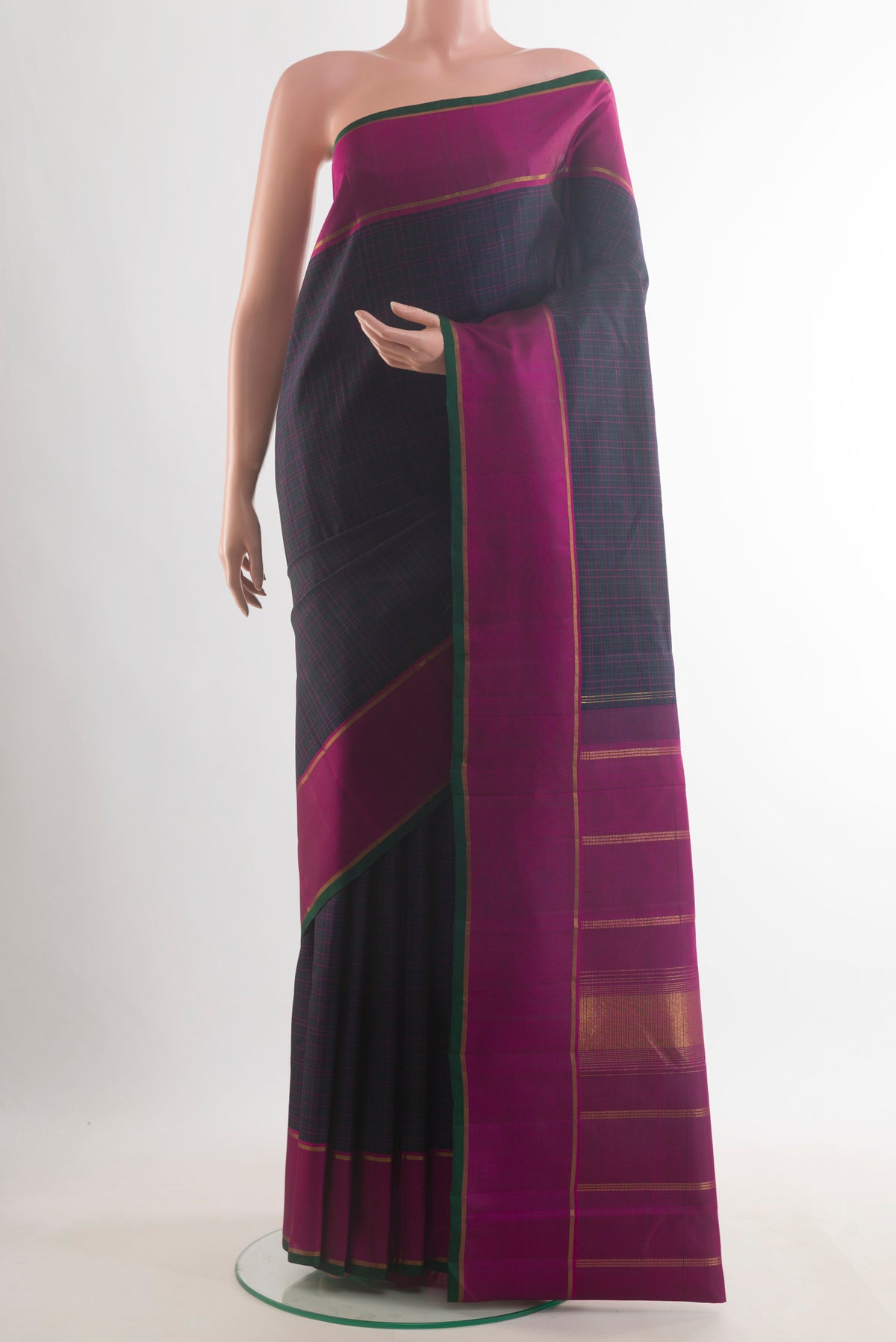 Pure Silk Navy Blue Kanchipuram Saree with Checked design on the body and Plain Border.  displayed on a mannequin